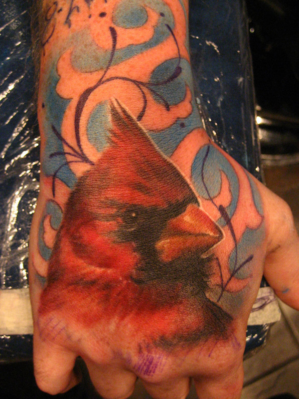 Bird tattoo on hand